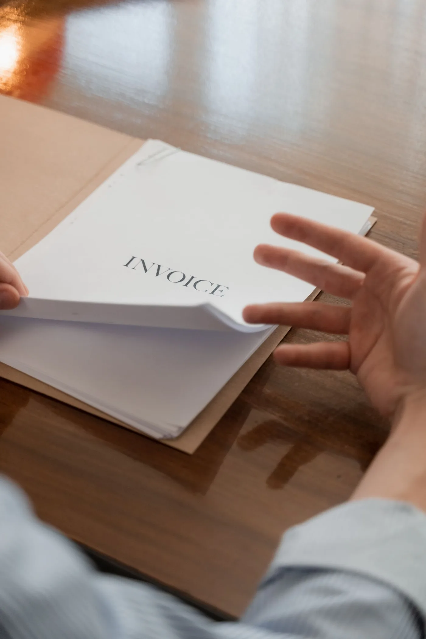 An invoice being checked by hand