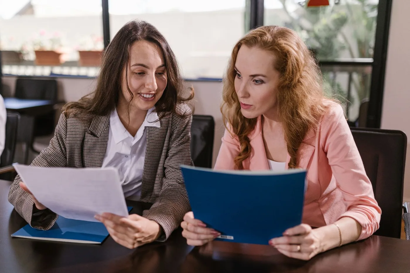 Colleagues reviewing a set of documents together