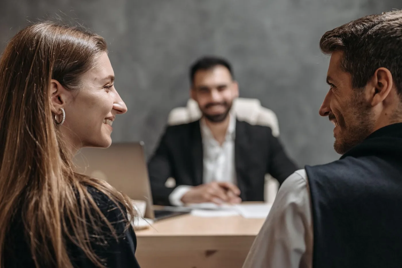 Warm client meeting at a law-office desk