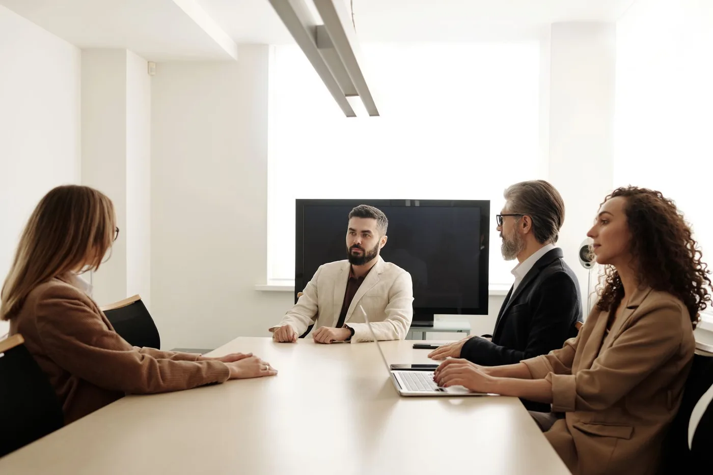 Team reviewing standards in a boardroom